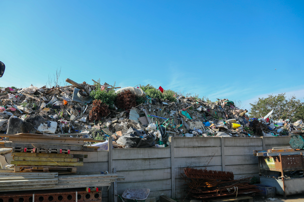 Stacks of household rubbish including bin liners, mattresses, wooden pallets and scrap metal are visible. (SWNS)