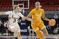 Tennessee guard Rae Burrell (12) dribbles the ball around Auburn guard Annie Hughes (3) during the first half of an NCAA college basketball game Thursday, Jan. 27, 2022, in Auburn, Ala. (AP Photo/Butch Dill)