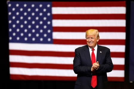 U.S. President Donald Trump takes the stage for a rally at the U.S. Cellular Center in Cedar Rapids, Iowa, U.S. June 21, 2017. REUTERS/Scott Morgan