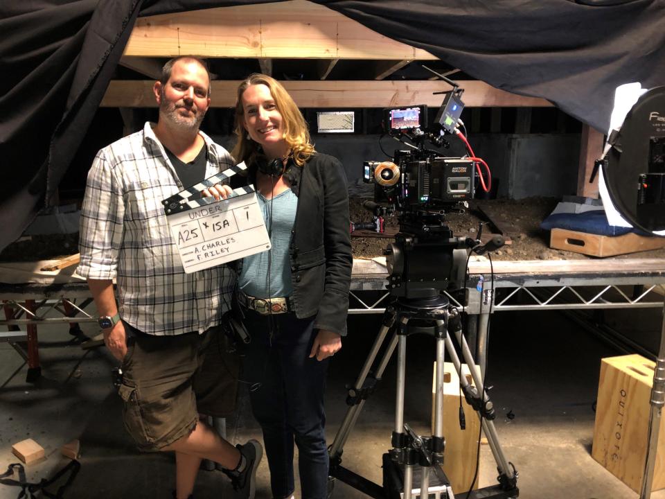 FSU alumna Aloura Charles, a writer, director and filmmaker, takes a photo on the set of short film "UNDER" with her husband Finn Riley, a cinematographer.