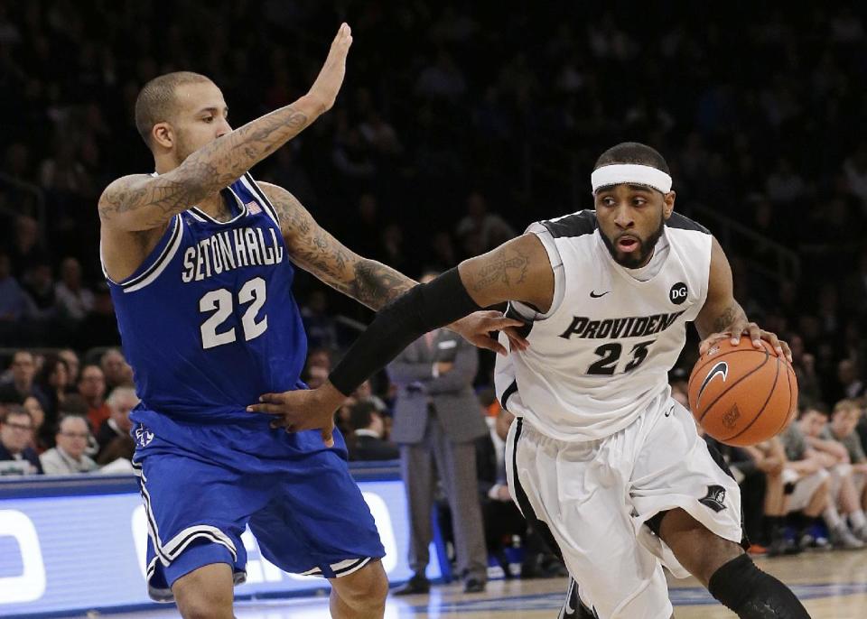 Providence's LaDontae Henton (23) drives past Seton Hall's Brian Oliver (22) during the first half of an NCAA college basketball game in the semifinals of the Big East Conference men's tournament Friday, March 14, 2014, at Madison Square Garden in New York. (AP Photo/Frank Franklin II)