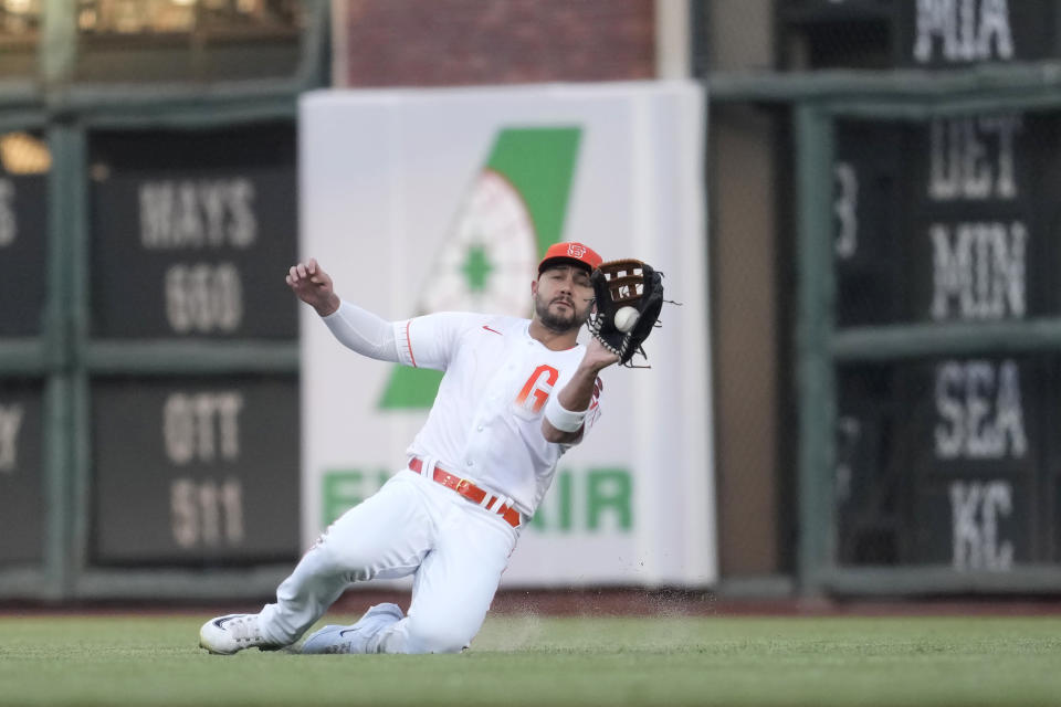 San Francisco Giants right fielder Michael Conforto catches a fly ball hit by Tampa Bay Rays' Jose Siri during the second inning of a baseball game in San Francisco, Tuesday, Aug. 15, 2023. (AP Photo/Jeff Chiu)