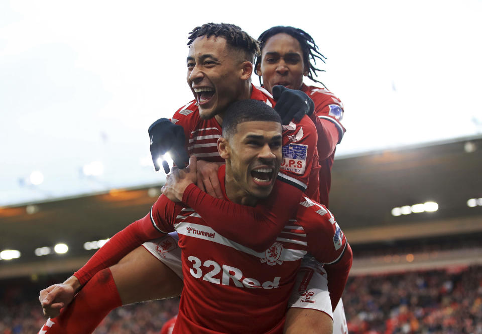 Middlesbrough's Ashley Fletcher celebrates scoring his side's first goal of the game with Marcus Tavernier, left, during their game against Tottenham, during their English FA Cup third round match at the Riverside Stadium in Middlesbrough, England, Sunday Jan. 5, 2020. (Owen Humphreys/PA via AP)