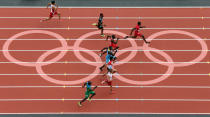 LONDON, ENGLAND - AUGUST 04: Justin Gatlin of the United States leads as he competes in the Men's 100m Round 1 Heats on Day 8 of the London 2012 Olympic Games at Olympic Stadium on August 4, 2012 in London, England. (Photo by Ian Walton/Getty Images)