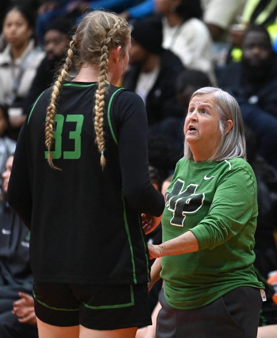 Myers Park’s Evelyn Jimenez-Willis, left, receives instructions from head coach Barbara Nelson, right, during prep action against Chambers High on Tuesday, November 28, 2023. JEFF SINER/jsiner@charlotteobserver.com