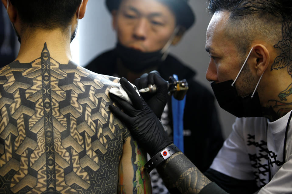 <p>A visitor to the London Tattoo Convention has a tattoo drawn on his body, in London, Britain, Sept. 23, 2017. (Photo: Peter Nicholls/Reuters) </p>