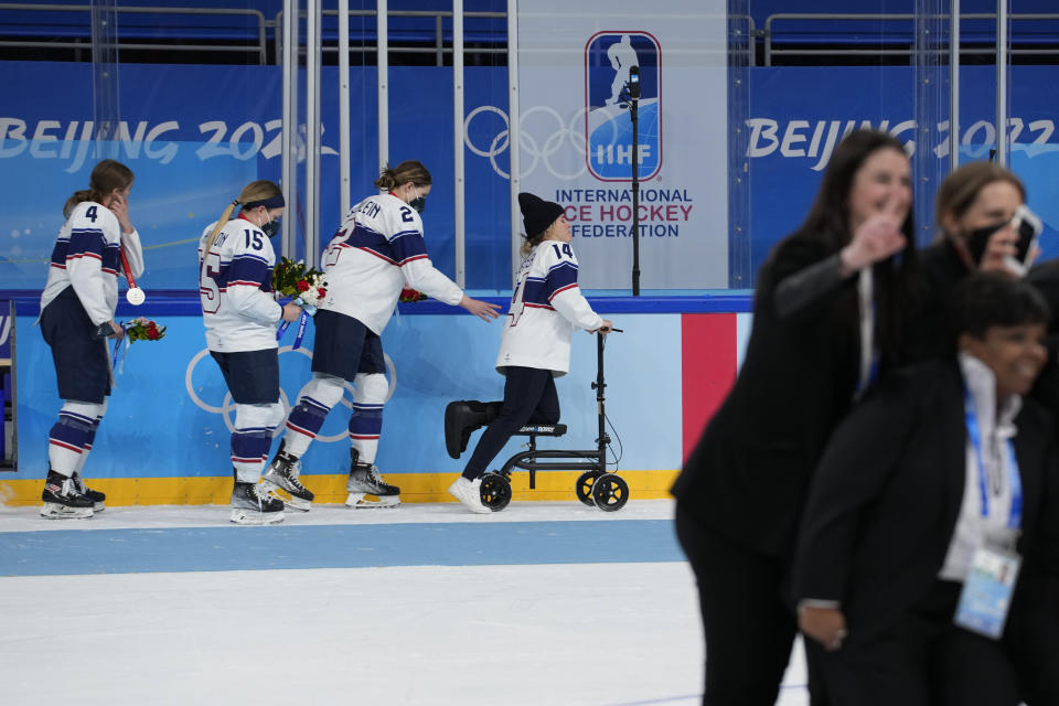 United States' Brianna Decker (14) leaves the the ice after losing to Canada in the women's gold medal hockey game at the 2022 Winter Olympics, Thursday, Feb. 17, 2022, in Beijing. (AP Photo/Petr David Josek)