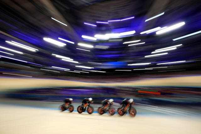 Ethan Hayter, Ollie Wood, Charlie Tanfield and Ethan Vernon moving at speed in the velodrome.