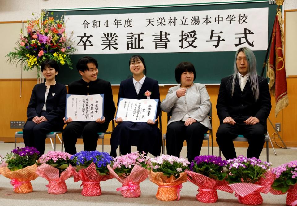 Eita and Aoi attend a photo session with their families (Reuters)