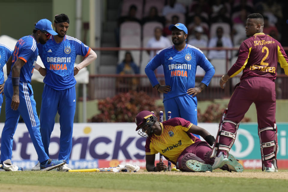 West Indies' Jason Holder grimaces after his dismissal during the second T20 cricket match against India at Providence Stadium in Georgetown, Guyana, Sunday, Aug. 6, 2023. (AP Photo/Ramon Espinosa)