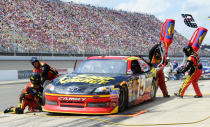 BROOKLYN, MI - JUNE 17: Clint Bowyer, driver of the #15 5-hour Energy Toyota, pits during the NASCAR Sprint Cup Series Quicken Loans 400 at Michigan International Speedway on June 17, 2012 in Brooklyn, Michigan. (Photo by John Harrelson/Getty Images for NASCAR)