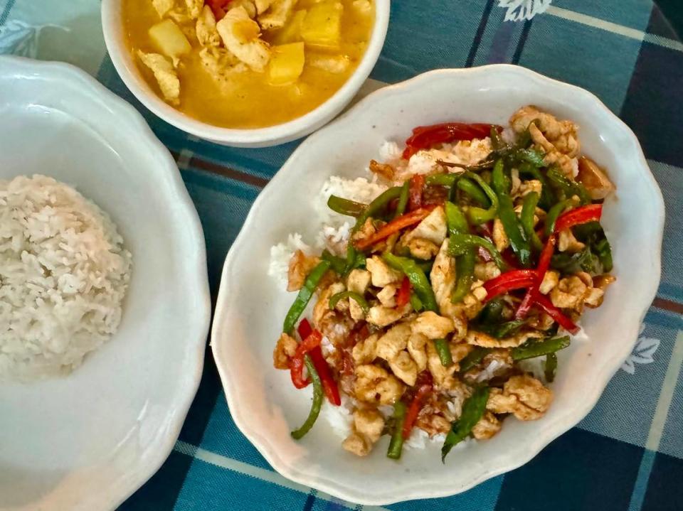 Basil chicken, right, and yellow Thai curry at J’s Burgers N’ More in downtown Fort Worth.