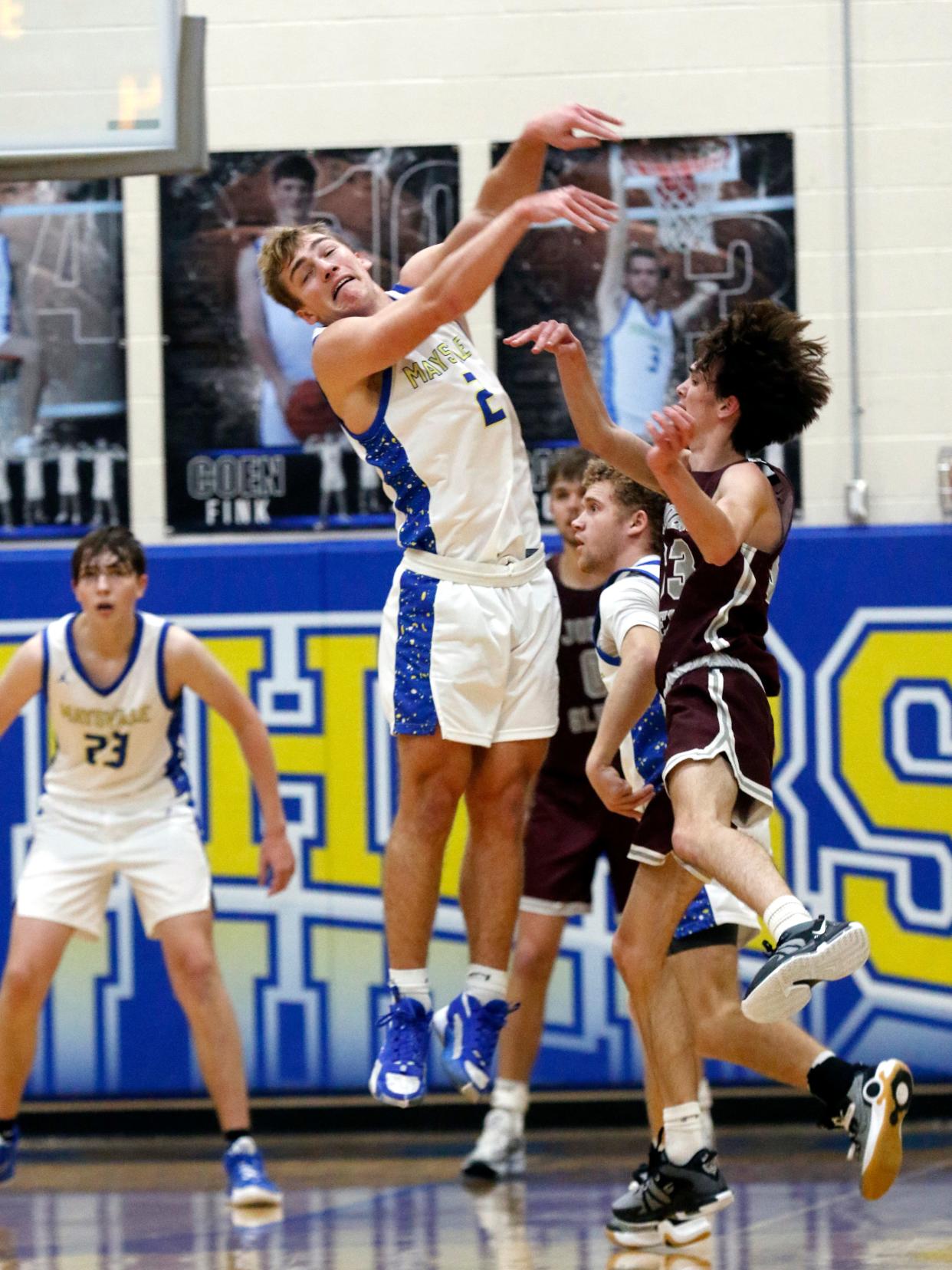 Maysville senior Wesley Armstead goes up to deflect a pass during a 45-28 win against visiting John Glenn on Friday night in Newton Township.