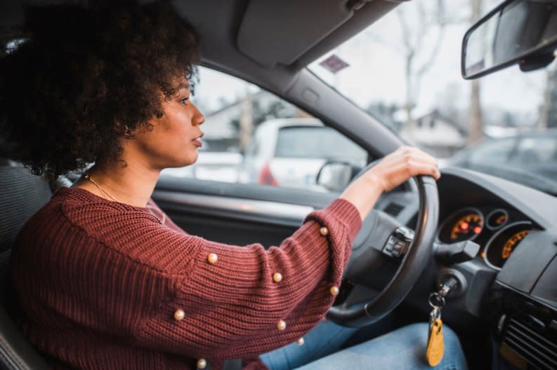 A person driving a car.