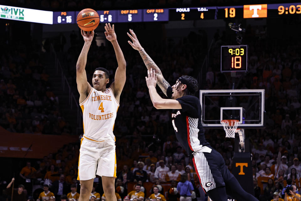 Tennessee guard Tyreke Key (4) shoots past Georgia guard Jusaun Holt (4) during the first half of an NCAA college basketball game Wednesday, Jan. 25, 2023, in Knoxville, Tenn. (AP Photo/Wade Payne)