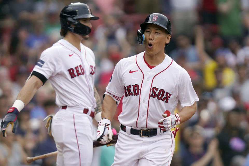 Boston Red Sox's Masataka Yoshida, right, celebrates in front of Jarren Duran, left, as he returns to the dugout in the eighth inning of a baseball game against the Oakland Athletics, Sunday, July 9, 2023, in Boston. (AP Photo/Steven Senne)