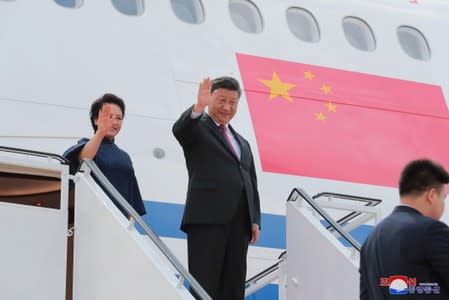 Chinese President Xi Jinping and North Korean leader Kim Jong Un meet in Pyongyang