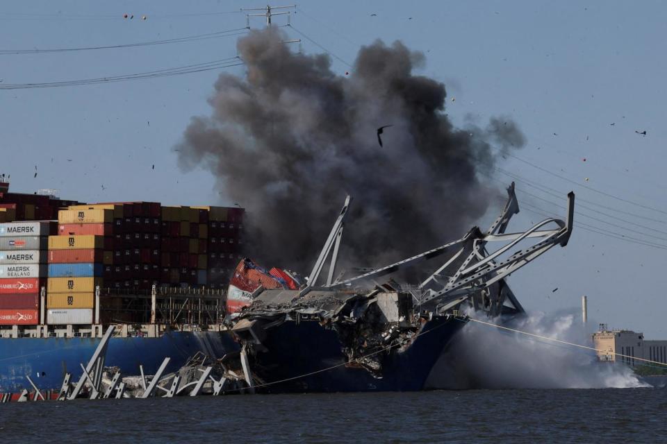 PHOTO: Smoke rises following a detonation of explosives to free the container ship Dali, after it was trapped following its collision with the Francis Scott Key Bridge in Baltimore, MD, May 13, 2024.  (Leah Millis/Reuters)