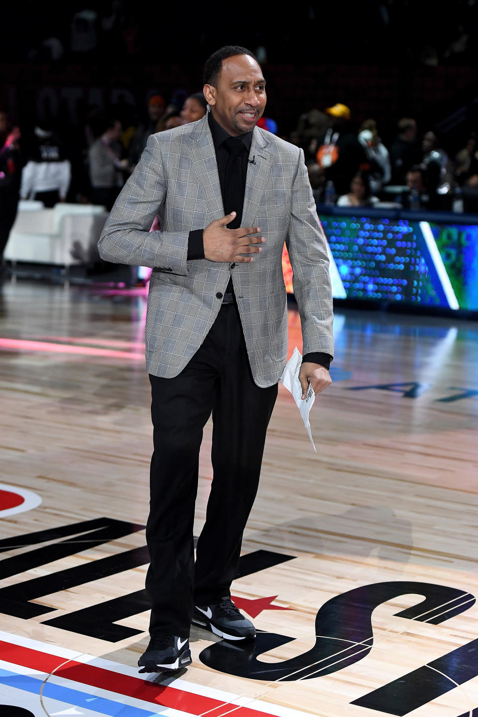 Stephen A. Smith wearing blazer on NBA court.