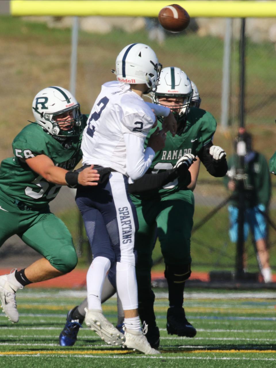 Senior Corey Petruzzella of Paramus gets rid of the ball before being tackled in a game against Ramapo in 2020.