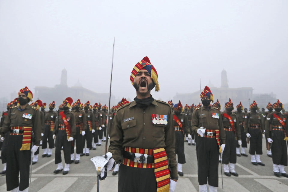 Major Piyush Sharma, from Indian Army Bengal Sappers, gives a command to his contingent for marching during rehearsals for the upcoming Republic Day parade at the Raisina hills, the government seat of power, in New Delhi, India, Monday, Jan. 18, 2021. Republic Day marks the anniversary of the adoption of the country's constitution on Jan. 26, 1950. Thousands congregate on Rajpath, a ceremonial boulevard in New Delhi, to watch a flamboyant display of the country’s military power and cultural diversity. (AP Photo/Manish Swarup)