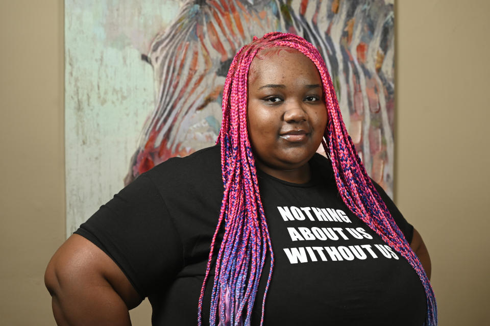 Victoria Bradley, 19, poses for a picture at her home, Sunday, Sept. 17, 2023, in Detroit. Historians say braids and other hairstyles served as methods of communication across African societies. After slavery was abolished, Black American hair became political. Although the Civil Rights Act of 1964 banned discrimination on the basis of race, color, religion, sex, and national origin, Black people continue to face professional and social stigma for not adopting grooming habits that fit white European beauty standards and norms. (AP Photo/Jose Juarez)