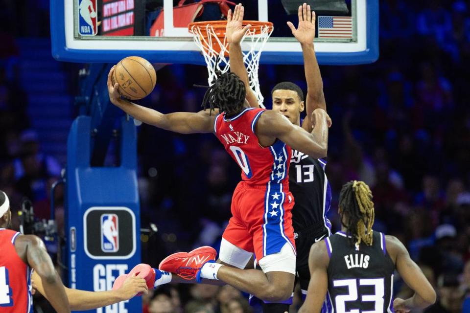 Philadelphia 76ers guard Tyrese Maxey (0) drives for a score against Sacramento Kings forward Keegan Murray (13) on Friday at Wells Fargo Center in Philadelphia.