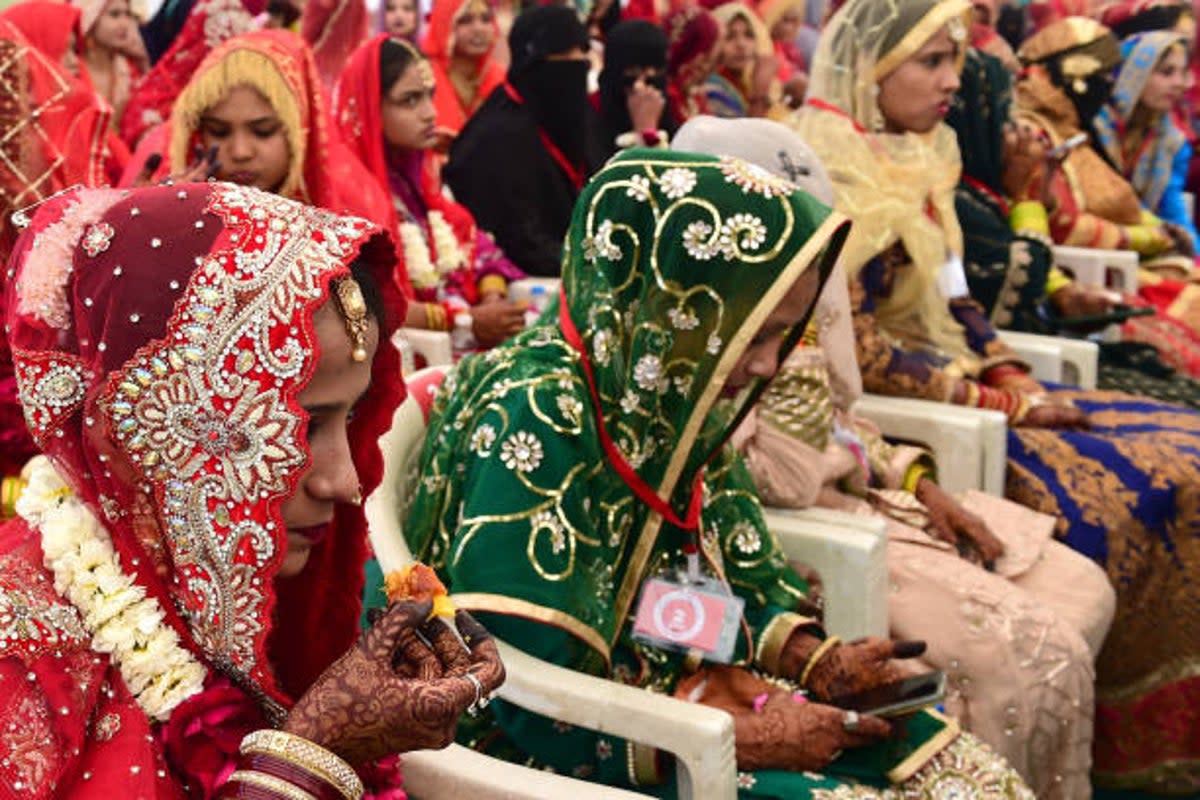 File image: Brides attend a mass Islamic marriage ceremony organised by the Gujarat Sarvajanik Welfare Trust in Ahmedabad on 4 February 2024 (AFP via Getty)