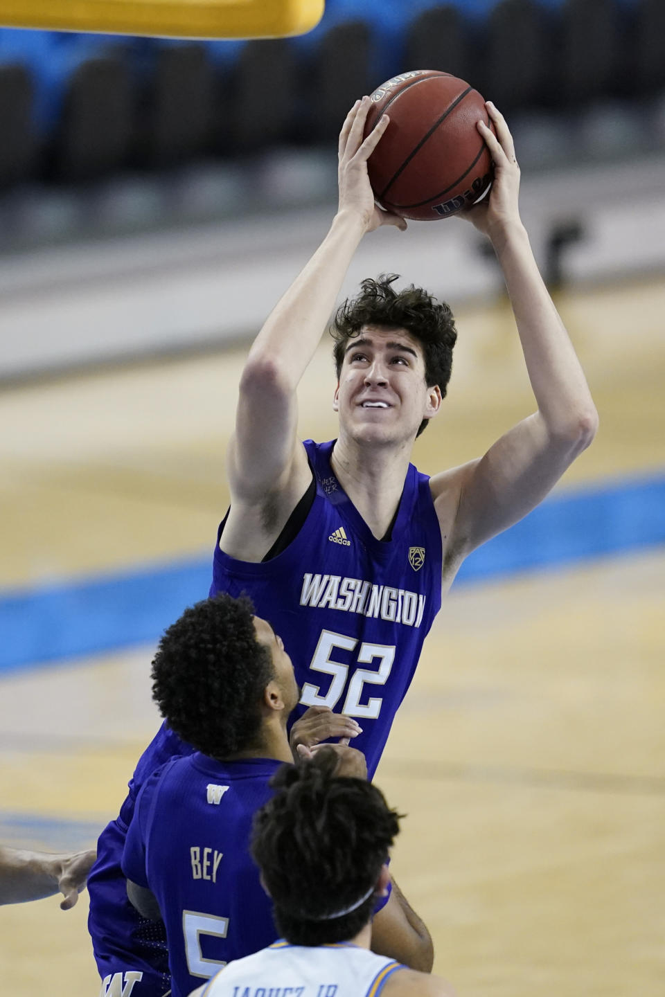 Washington center Riley Sorn (52) takes a shot during the first half of an NCAA college basketball game against the UCLA Saturday, Jan. 16, 2021, in Los Angeles. (AP Photo/Ashley Landis)