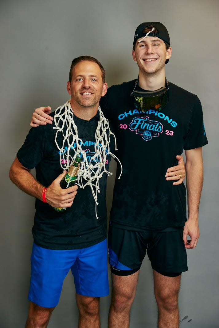 Natick’s Ryan Mela, right, with Middlesex Magic coach Michael Crotty after winning the Under Armour Association championship over the summer.