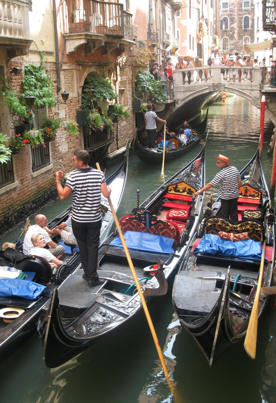 This July 15, 2012 photo shows Gondolas in a traffic jam on the narrow canals of Venice. To travel through northern Italy with a copy of Mark Twain’s 1869 ‘'The Innocents Abroad', his classic 'record of a pleasure trip'. It took him to the great sights of Europe and on to Constantinople and Jerusalem before he sailed home to New York. Such a trip would take far too big a chunk out of my holiday time. But, Milan, Florence and Venice, a mere fragment for Twain, was within my reach for a two-week vacation. (AP Photo/Raf Casert)