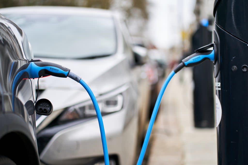 Electric car charging (John Walton/PA) (PA Archive)