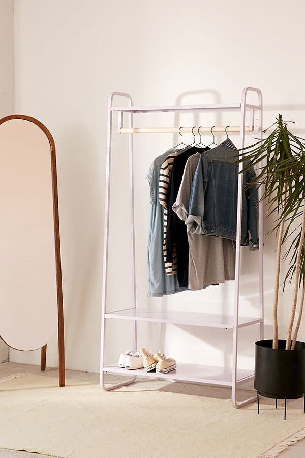 No closet, no problem! If you're looking for <a href="https://www.huffingtonpost.com/entry/store-your-clothes-without-a-closet_us_5acb6d66e4b09d0a1195c636" target="_blank">ways to store your clothes without a closet</a>, an open closet system is the solution to your closet-less woes. Get this <a href="https://www.urbanoutfitters.com/shop/cameron-clothing-rack?category=SEARCHRESULTS&amp;color=053" target="_blank">garment rack with multiple shelving units</a>&nbsp;at Urban Outfitters.