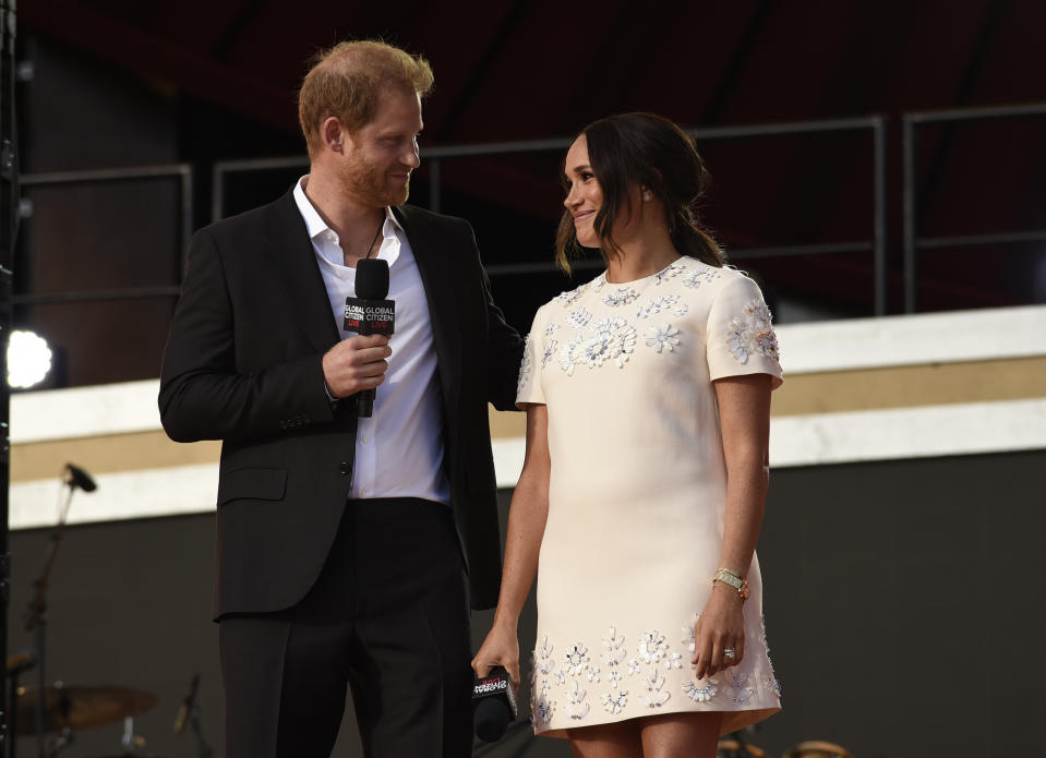 Prince Harry, the Duke of Sussex, left, and Meghan, the Duchess of Sussex speak at Global Citizen Live in Central Park on Saturday, Sept. 25, 2021, in New York. (Photo by Evan Agostini/Invision/AP)