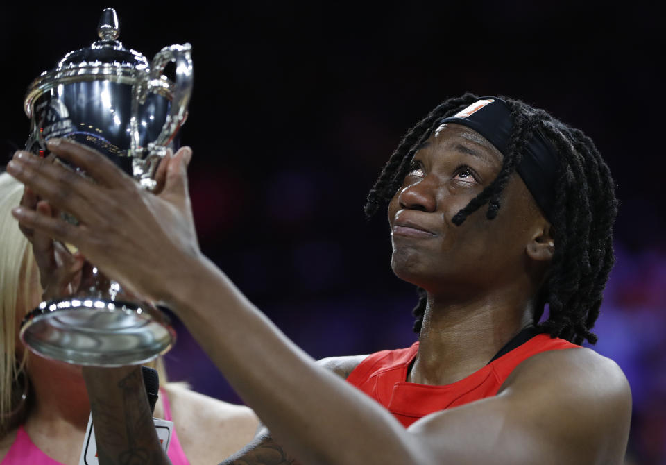Indiana Fever's Erica Wheeler, of Team Wilson, cries as she holds up the MVP trophy after winning the honor at the WNBA All-Star basketball game Saturday, July 27, 2019, in Las Vegas. (AP Photo/John Locher)