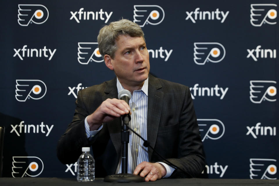 FILE - Philadelphia Flyers general manager Chuck Fletcher speaks to the media during an introductory press conference for head coach Alain Vigneault at the Flyer's practice facility in Voorhees, N.J., in this Thursday, April 18, 2019, file photo. The Flyers were a mess last season and general manager Chuck Fletcher knew it. He's traded five players and three draft picks in the last week and is trying to make them contenders again in the East. (AP Photo/Matt Slocum, File)