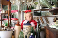 A seven-year-old schoolgirl is raking in hundreds of pounds by selling antique bottles from a little shop in her back garden - after digging them up from old landfill sites. Betsy-Mae Lloyd has been coining it in after launching her own business at her parents' home while still attending primary school. The young entrepreneur flogs old bottles, jars and teapots - dating back to between the 1870s and 1930 - which she finds on historic landfill sites in the West Midlands. After taking them home and cleaning them up herself, she then stores them in a Victorian-style play shed, built by dad Jason, before listing them for sale on Facebook. 