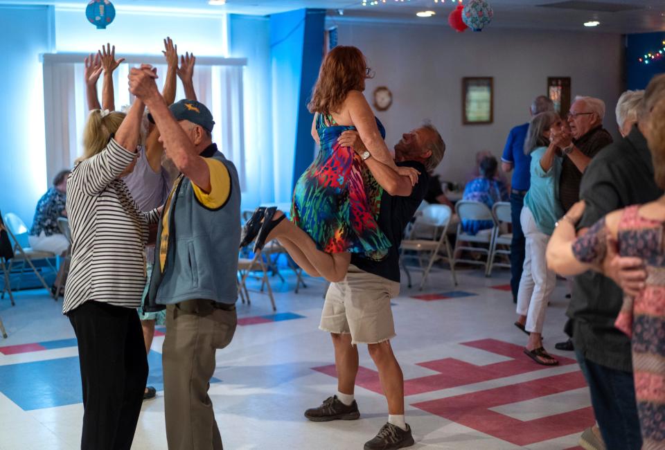 Arnie Perala, of Lake Linden, lifts his wife, Jean Perala, during a dance at a weekly polka dance held at the South Range Eagles Club in South Range on Sunday, July 23, 2023, in Michigan's Upper Peninsula.