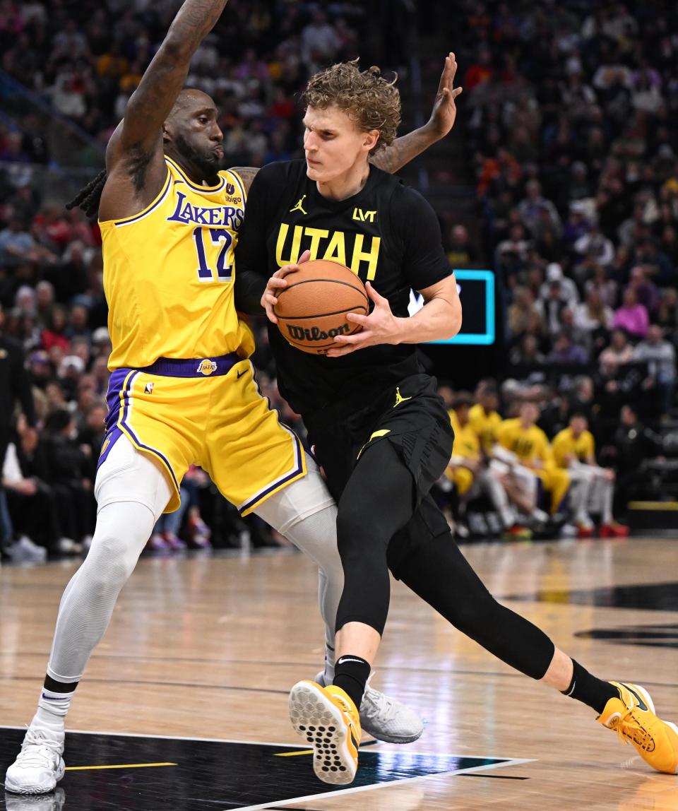 Utah Jazz forward <a class="link " href="https://sports.yahoo.com/nba/players/5769/" data-i13n="sec:content-canvas;subsec:anchor_text;elm:context_link" data-ylk="slk:Lauri Markkanen;sec:content-canvas;subsec:anchor_text;elm:context_link;itc:0">Lauri Markkanen</a> (23) drives on Los Angeles Lakers forward Taurean Prince (12) as the Utah Jazz and the Los Angeles Lakers play at the Delta Center in Salt Lake City on 2/14/24. | Scott G Winterton, Deseret News