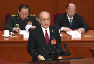 Zhang Jun, president of the Supreme People's Court, delivers a speech during the second plenary session meeting of the National People's Congress (NPC) in the Great Hall of the People in Beijing, China, Friday, March 8, 2024. (AP Photo/Tatan Syuflana)