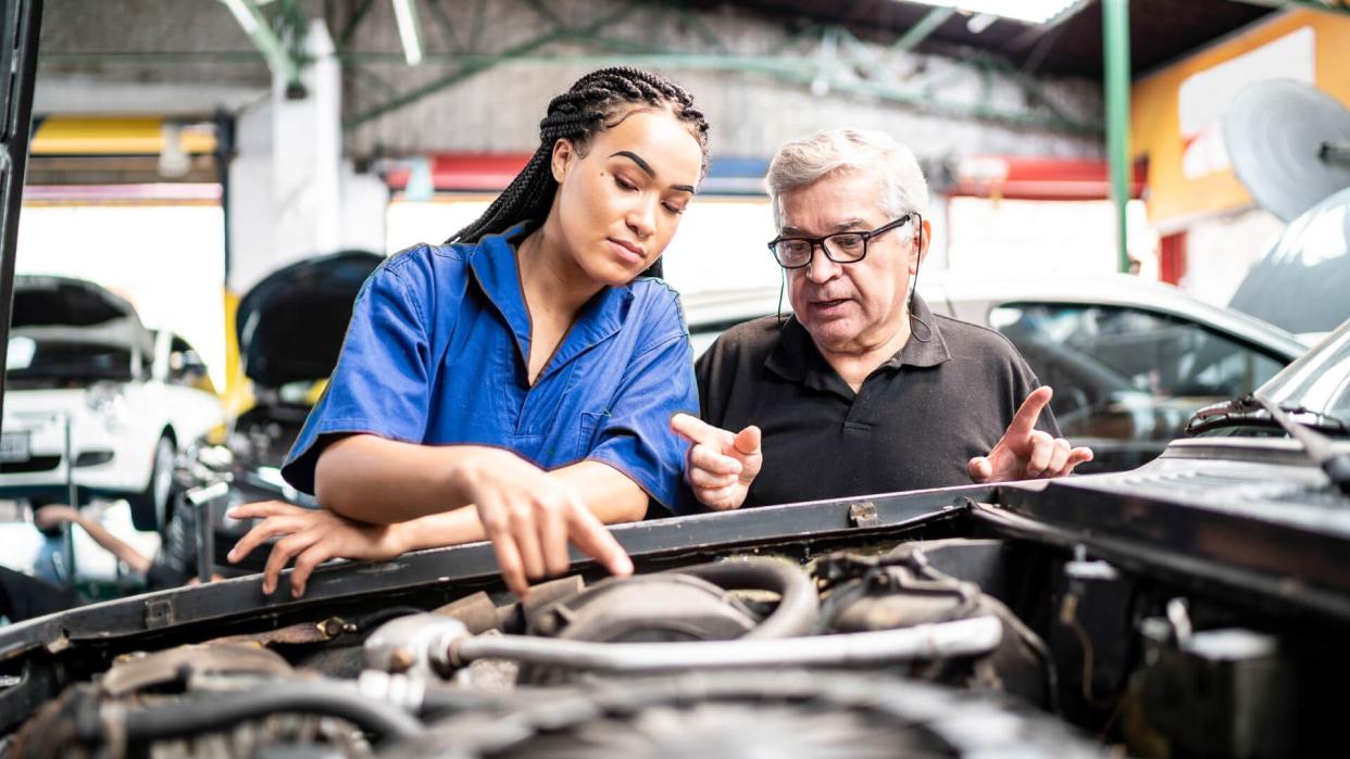 Mechanic partners in a auto repair shopu.