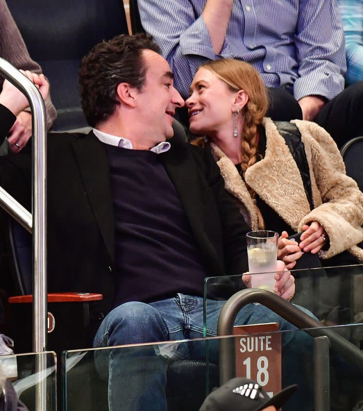 Mary-Kate Olsen rocking her statement pigtails while enjoying a basketball game with her hubby. 