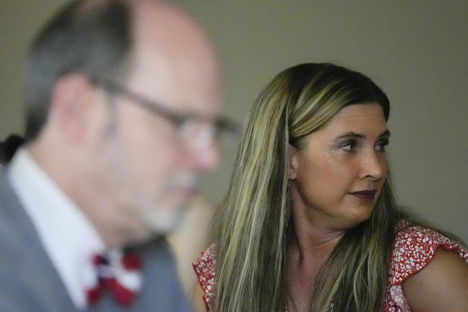 Regan Box, right, U.S. Senate candidate from Georgia, attends a gathering where Douglas G. Frank, left, speaks about the Georgia election process, Sunday, March 24, 2024, in Rome, Ga. Frank is among those urging people to file voter challenges using a software tool called EagleAI to get potentially ineligible voters removed from the registration rolls. (AP Photo/Mike Stewart)