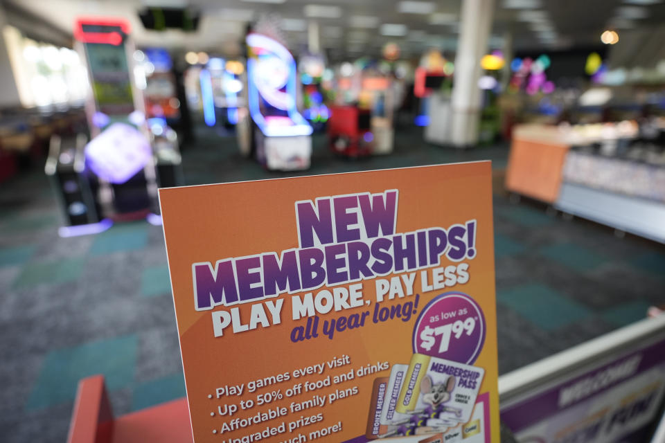 A sign advertises new memberships at the entrance to a Chuck E-Cheese location Wednesday, March 13, 2024, in San Diego. Paid loyalty programs are all the rage in the restaurant and retail world. Looking for reliable sales in an unpredictable spending environment, more companies have extended their points-based loyalty tiers to making their most dependable customers feel valued for an up-front fee. (AP Photo/Gregory Bull)