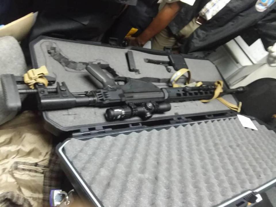 This photo of the weapons brought into Haiti by Jacques Yves Duroseau was circulated on social media after Duroseau’s arrest in Port-au-Prince Tuesday after arriving aboard an American Airlines flight from Miami. Two police officials confirmed that the photos are from the incident, according to the Miami Herald.