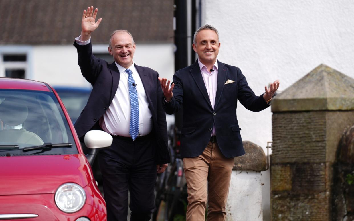 Sir Ed Davey (left) arrives with Alex Cole-Hamilton, Scottish Lib Dem leader, at the launch in North Queensferry