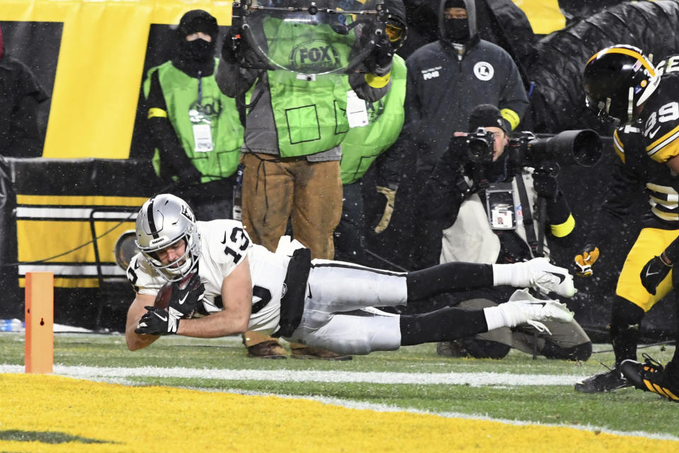 Las Vegas Raiders wide receiver Hunter Renfrow (13) dives for a touchdown during the first half of an NFL football game against the Pittsburgh Steelers in Pittsburgh, Saturday, Dec. 24, 2022. (AP Photo/Fred Vuich)