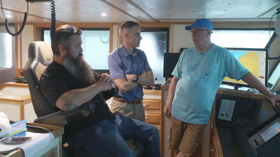 PHOTO: Stefan Axelsson, left, and Bill Bright, right, speak with ABC News' Devin Dwyer about their legal battle against government regulation of the herring fishery. (ABC News)