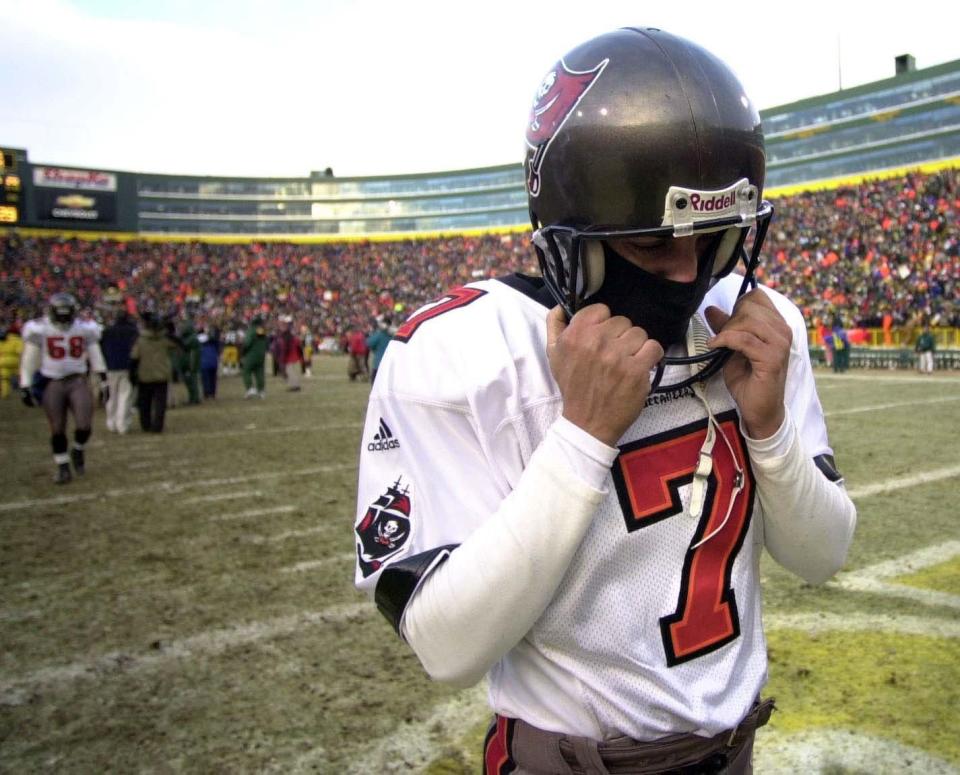 Tampa Bay Buccaneers kicker Martin Gramatica leaves Lambeau Field after he missed a field goal with 9 seconds left.