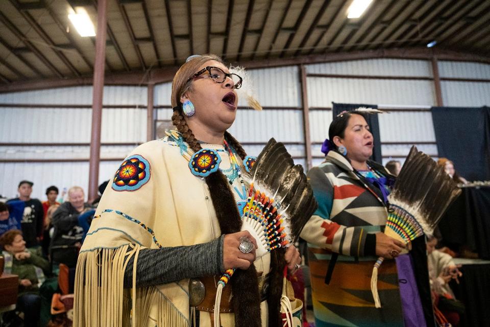 Sally Kerchee Strye and Nicole Pavatea sing during the Austin Powwow at the Travis County Expo Center on Saturday. The powwow is a Native American heritage festival featuring a traditional dance competition, a market and food.